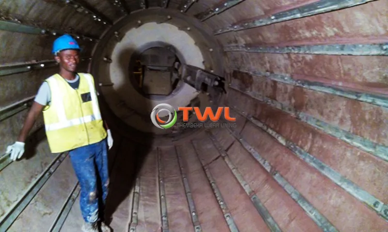 TWL field technician inside large industrial equipment