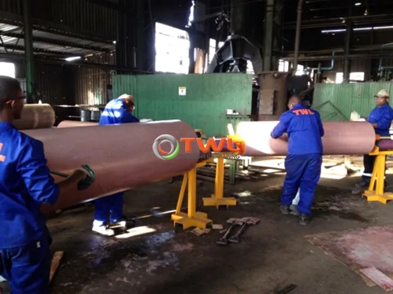 TWL team working on industrial equipment in the workshop